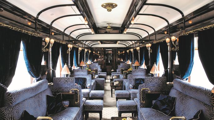 Blue upholstered furnishings on the bar car of the Orient Express.