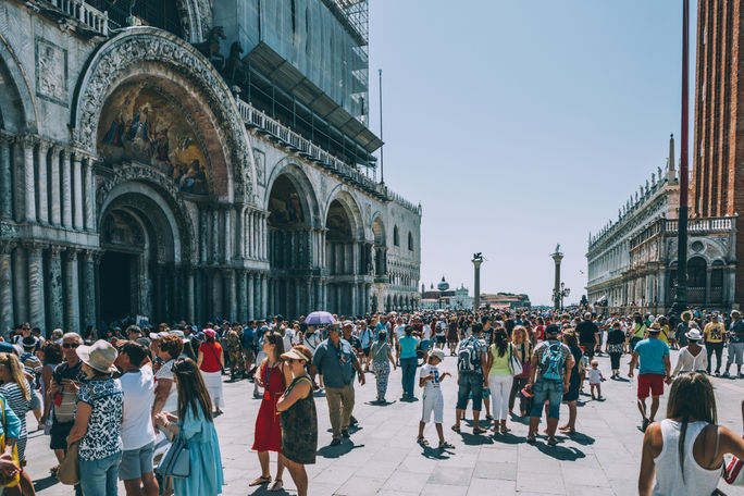Crowds of travelers in St. Mark's Square, Venice, Italy