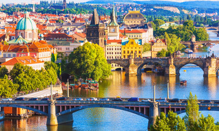 Scenic summer aerial view of the Old Town pier architecture and Charles Bridge over Vltava river in Prague, Czech Republic (Photo via scanrai / iStock / Getty Images Plus)