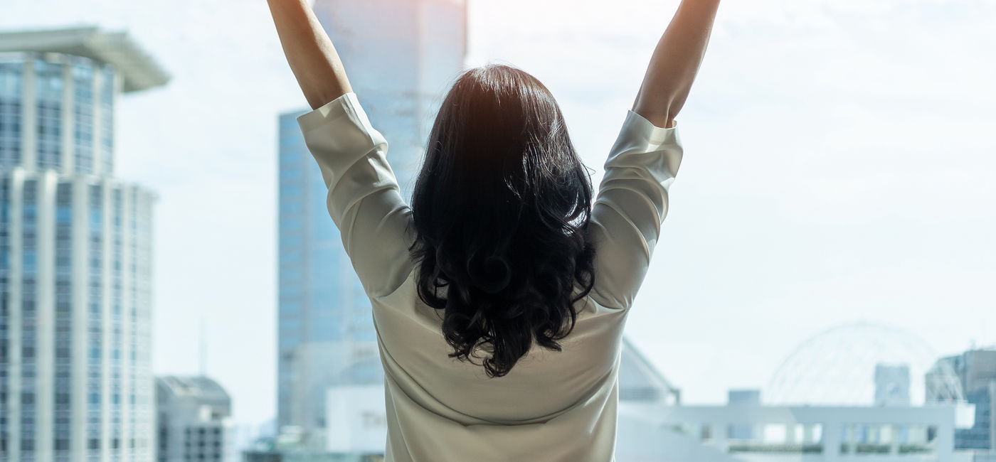 Image: A female business leader celebrating her success. (photo via iStock/Getty Images Plus/Chinnapong)