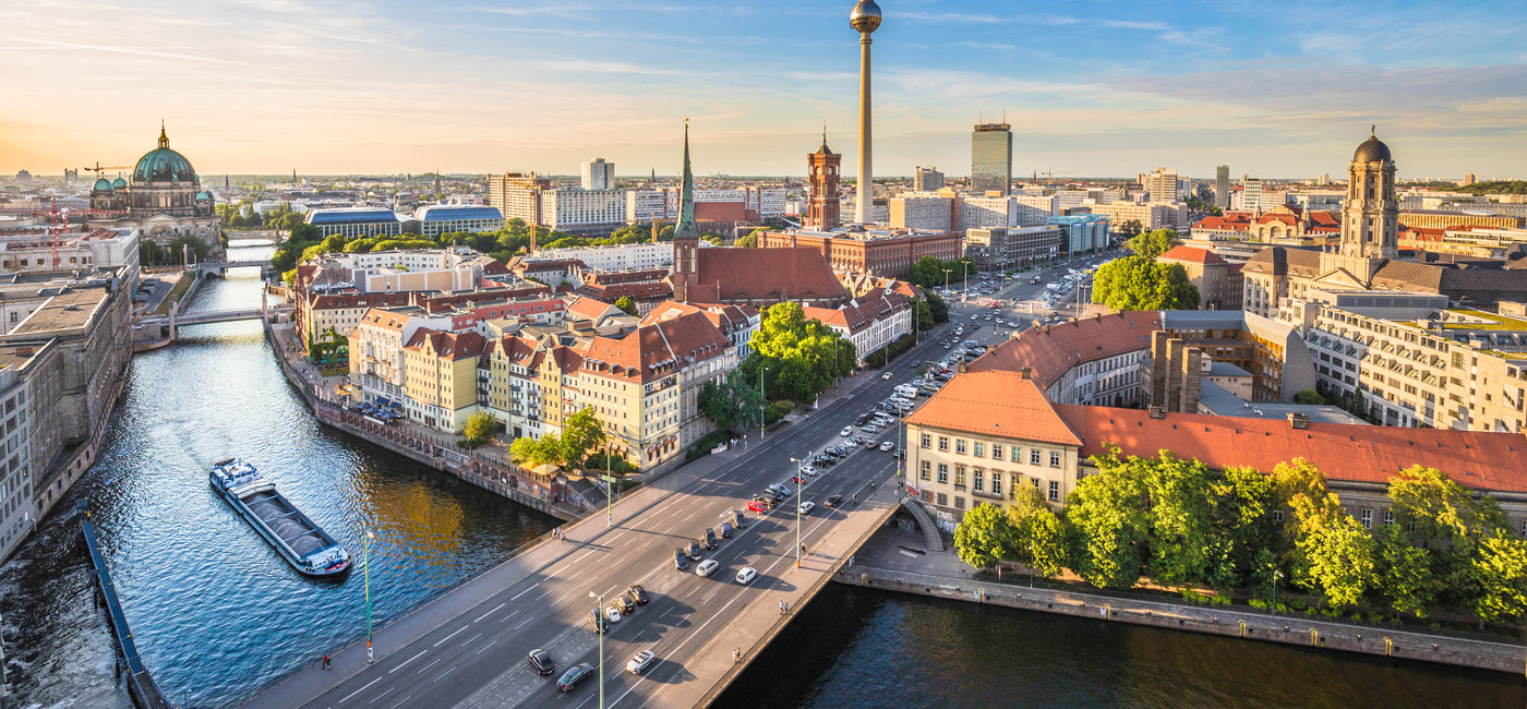 Image: Aerial view of Berlin skyline with famous TV tower and Spree river in beautiful evening light at sunset, Germany. (photo via bluejayphoto/iStock/Getty Images Plus)