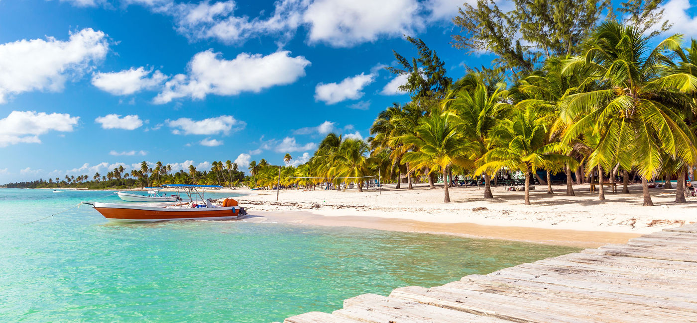 Image: Beautiful Caribbean beach on Saona Island, Dominican Republic. (photo via czekma13 / iStock / Getty Images Plus)