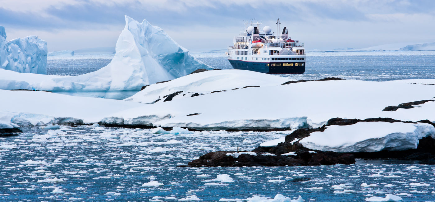 Image: PHOTO: Big cruise ship in the Antarctic waters (Photo via goinyk / iStock / Getty Images Plus)
