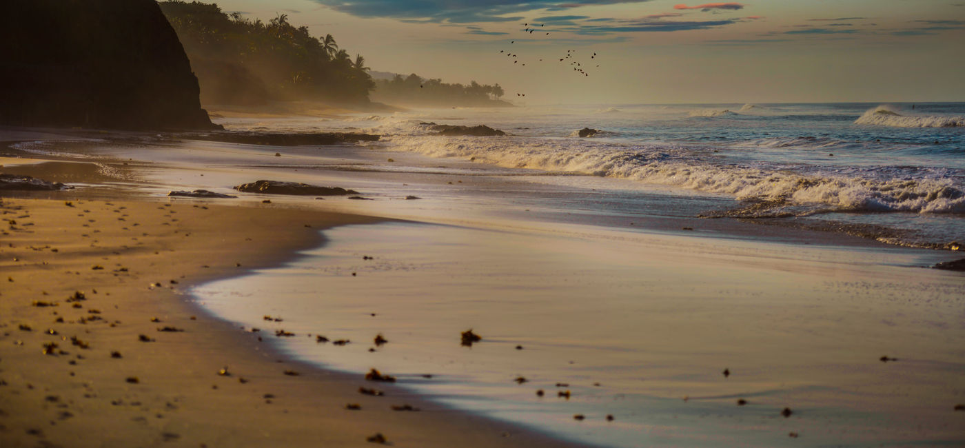 Image: PHOTO: Sunrise at Pacific beach, Riviera Nayarit, Mexico. (photo via La_Corivo / iStock / Getty Images Plus)