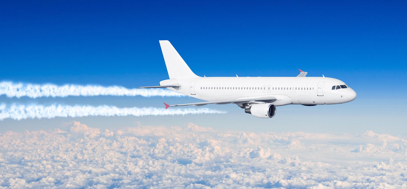 Image: PHOTO: White aircraft with contrail clouds. (Photo via iStock / Getty Images Plus / aapsky)