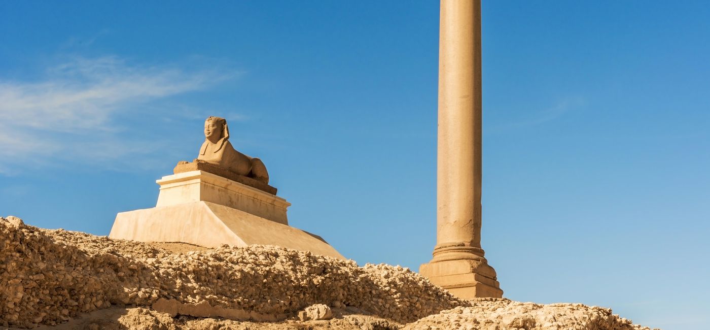 Image: Pompey's Pillar is a Roman triumphal column in Alexandria, Egypt, and the largest of its type constructed outside the imperial capitals of Rome and Constantinople. It is one of the largest monolithic columns ever erected. (Photo Courtesy of iStock / Getty Images Plus/MarcPo)