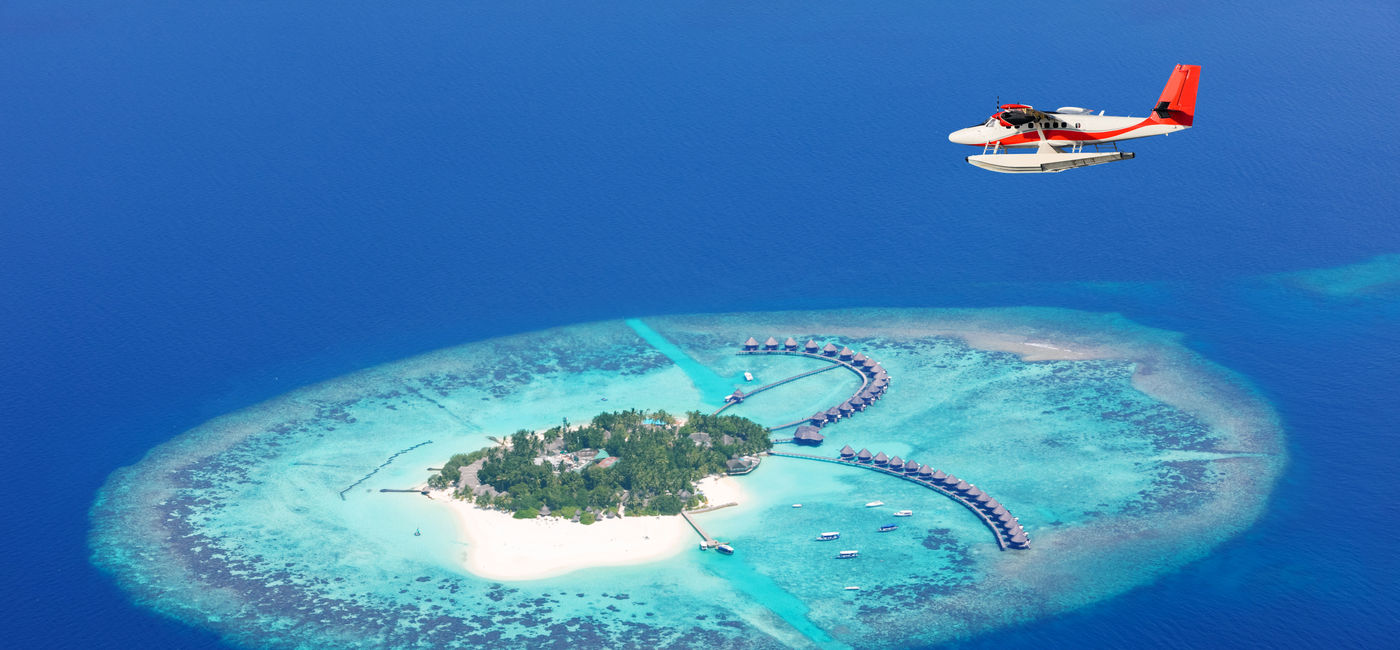 Image: Seaplane flying above Raa Atol in the Maldives. (photo via Jag_cz / iStock / Getty Images Plus)