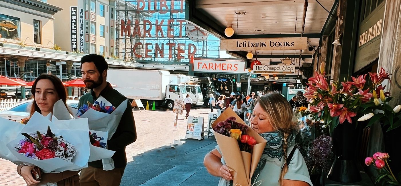 Image: Stopping to smell the flowers at Pike Place Market. (photo by Jessica Kelly)
