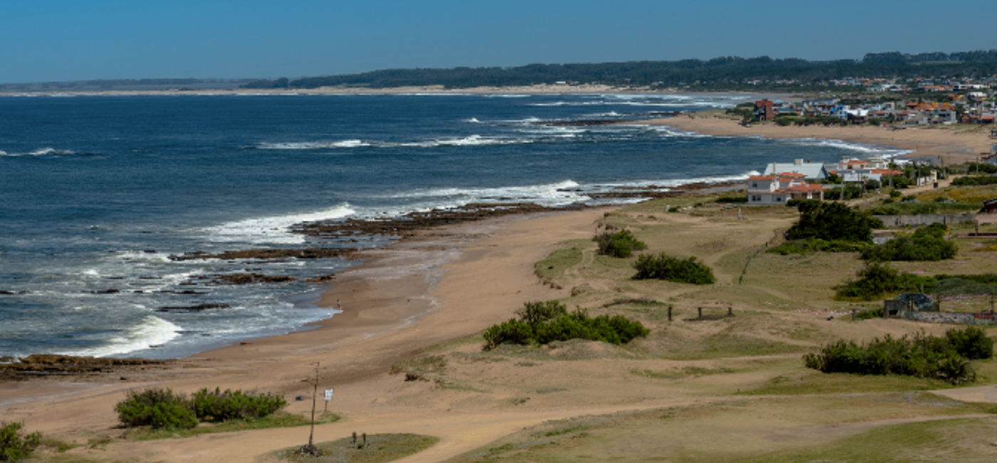 Image: The beaches of Uruguay invite visitors to rest and enjoy them with their families. (Photo via MarcosMartinezSanchez/iStock/Getty Images Plus).