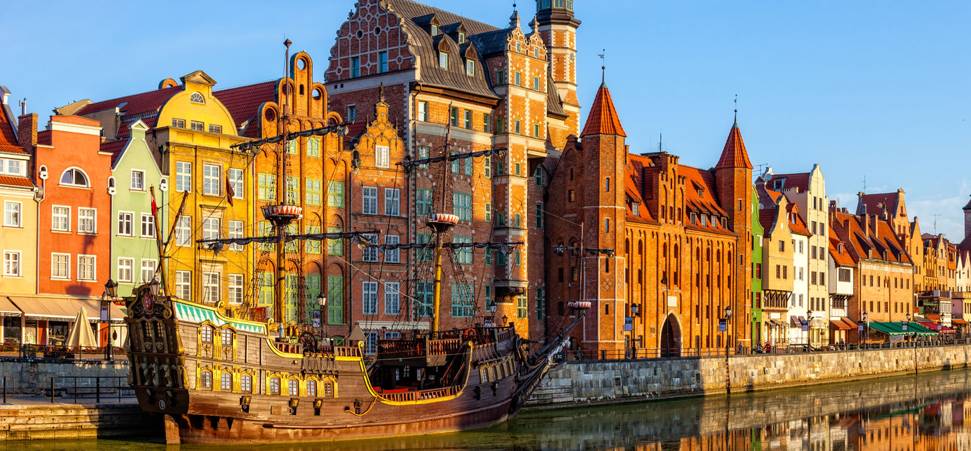 Image: The riverside with the characteristic promenade of Gdansk, Poland. (photo via nightman1965 / iStock / Getty Images Plus)