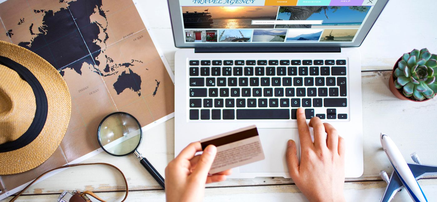 Image: Travel planning concept on table. (photo via seb_ra /iStock / Getty Images Plus)
