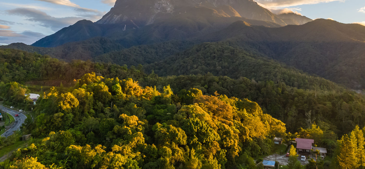 Image: View of Kinabalu National Park, with Mount Kinabalu soaring overhead in Malaysia. (photo via yusnizam / iStock / Getty Images Plus) (Photo Credit: (photo via yusnizam / iStock / Getty Images Plus))