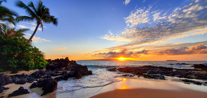 Makena Secret Beach at sunset in Maui, Hawaii.