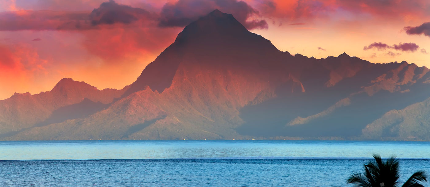 View on mountain Orohena at sunset. Polynesia. Tahiti. (photo via Konstik / iStock / Getty Images Plus)