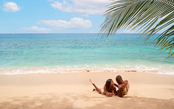 Couple on the beach at Sandals Grenada