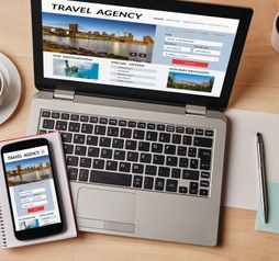 Travel agency concept on laptop and smartphone screen