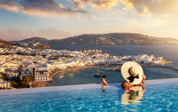 Luxury travel, luxury travelers, infinity pool, wine, Mykonos, Greece